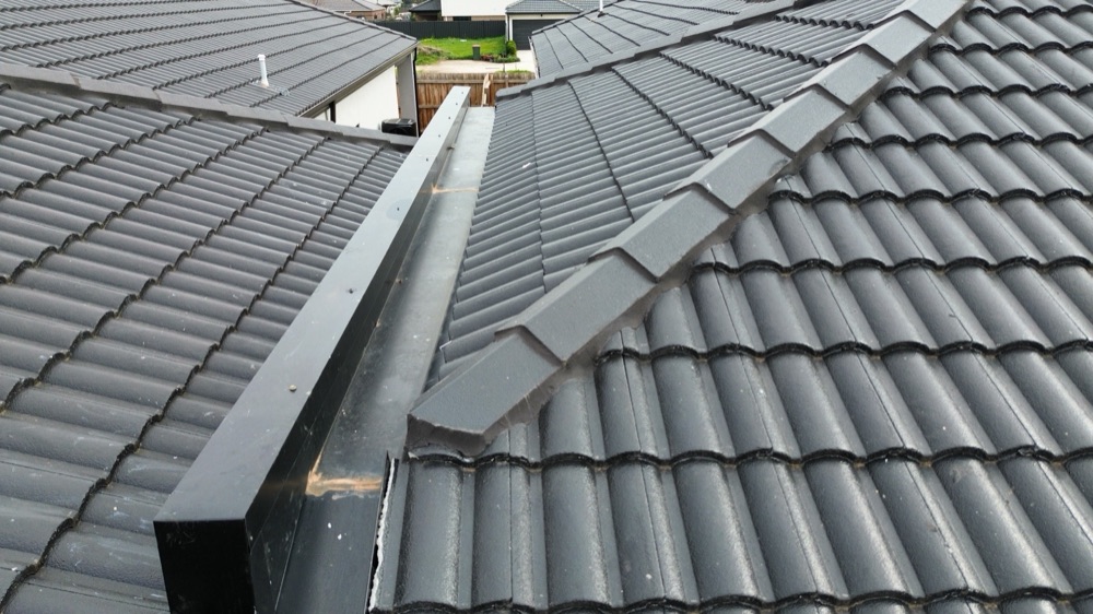 Cappings fixed from above rather than the required method, noted during a pre-handover inspection in Melton South