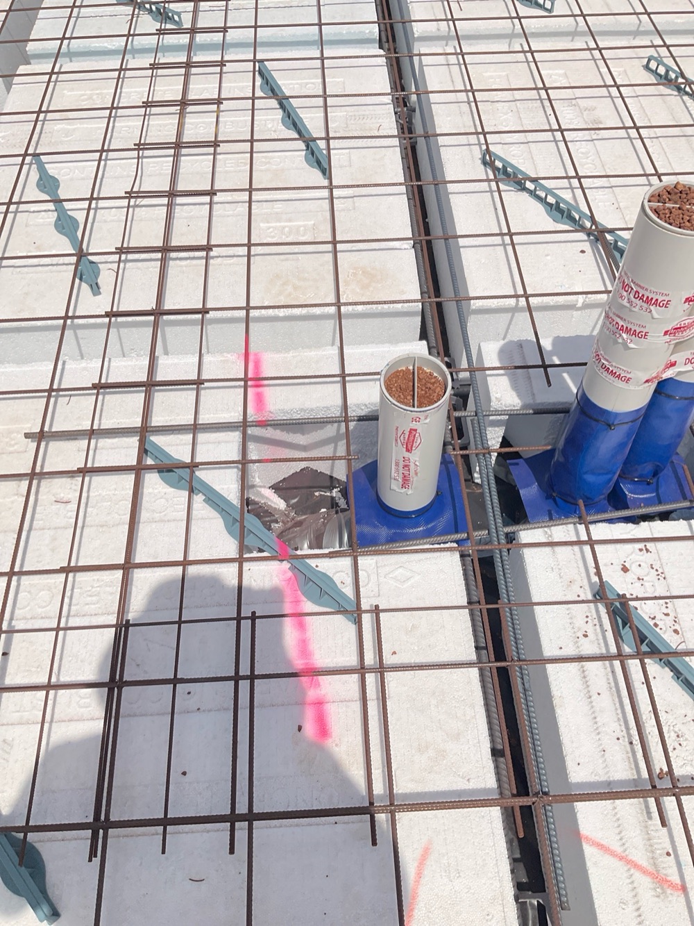 N16 bars not installed around service penetrations, noted during a slab pre-pour inspection in Melton South