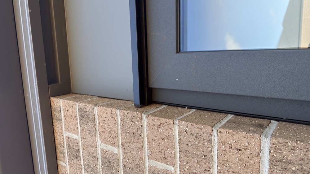 Wall, eave, door and window joints left uncaulked, noted during a pre-handover inspection in Melton South